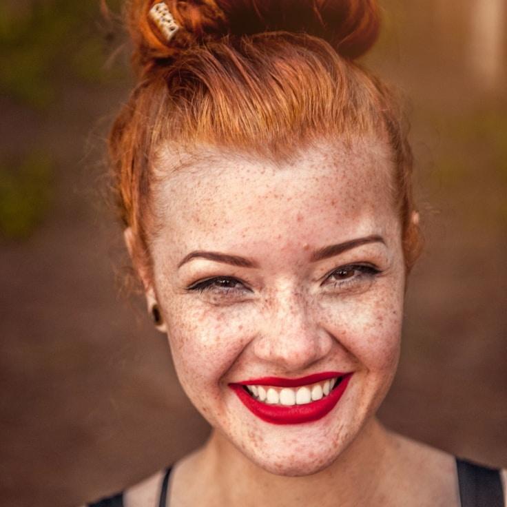 Kaveri Mehta, Lead Design Curator at Harbor Line Nook, reviewing corporate floral arrangements